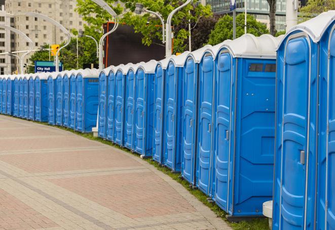 portable restrooms stationed outside of a high-profile event, with attendants available for assistance in Atlantic Beach